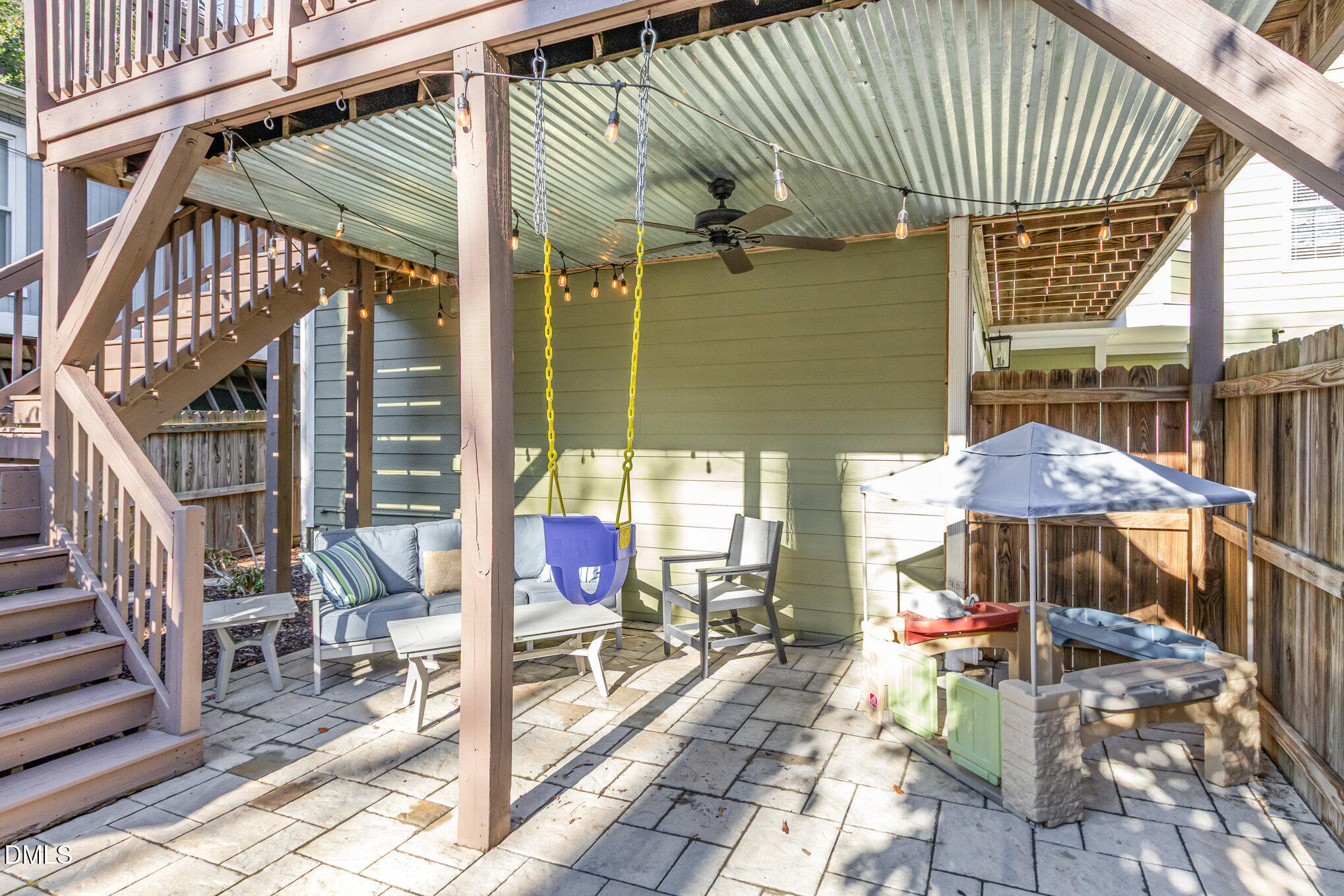 1340 Courtland Drive Raleigh, NC 27604 - Photo 35 of 42 a view of a patio with table and chairs potted plants with wooden floor and fence