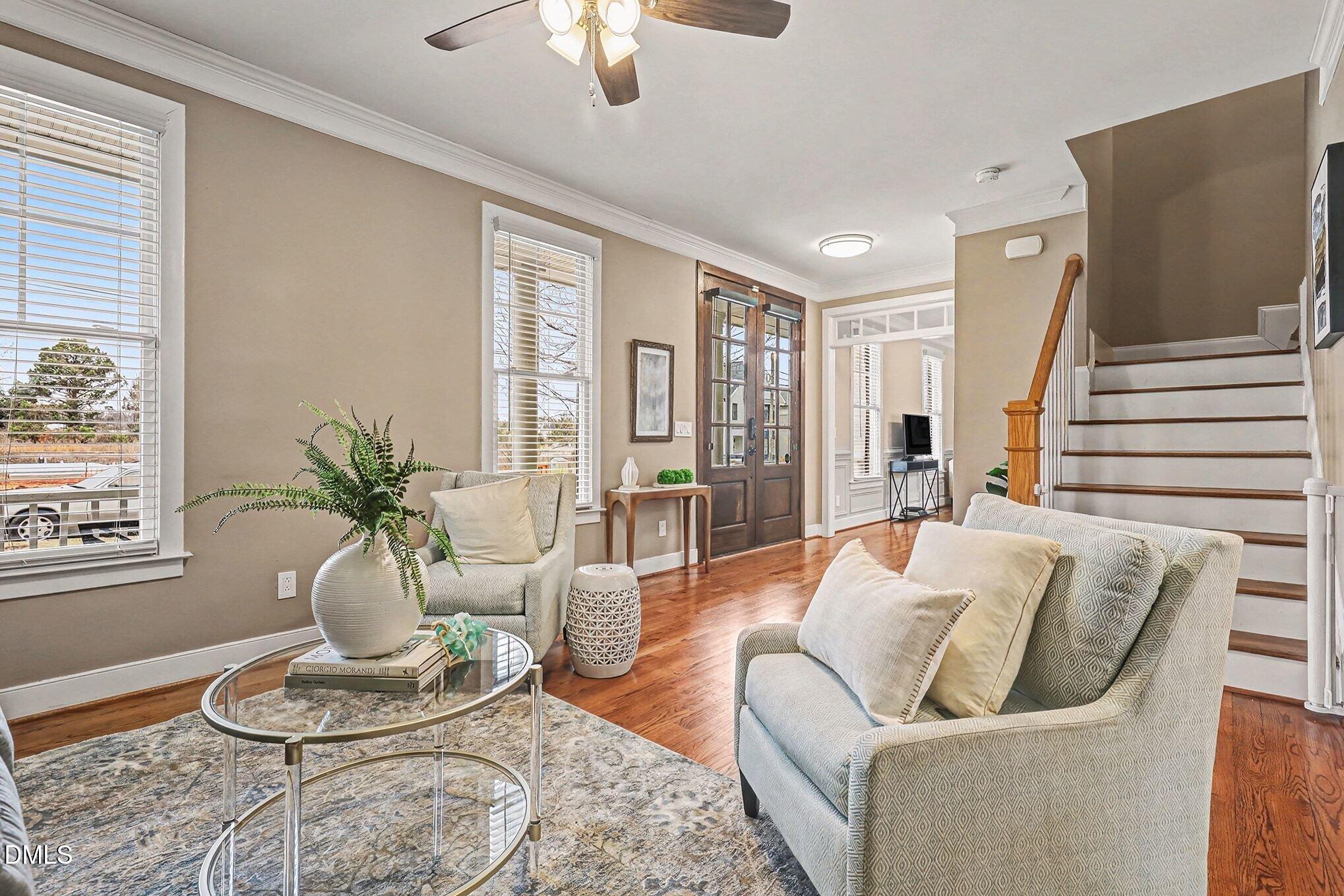 1340 Courtland Drive Raleigh, NC 27604 - Photo 5 of 42 a living room with furniture potted plant and a large window