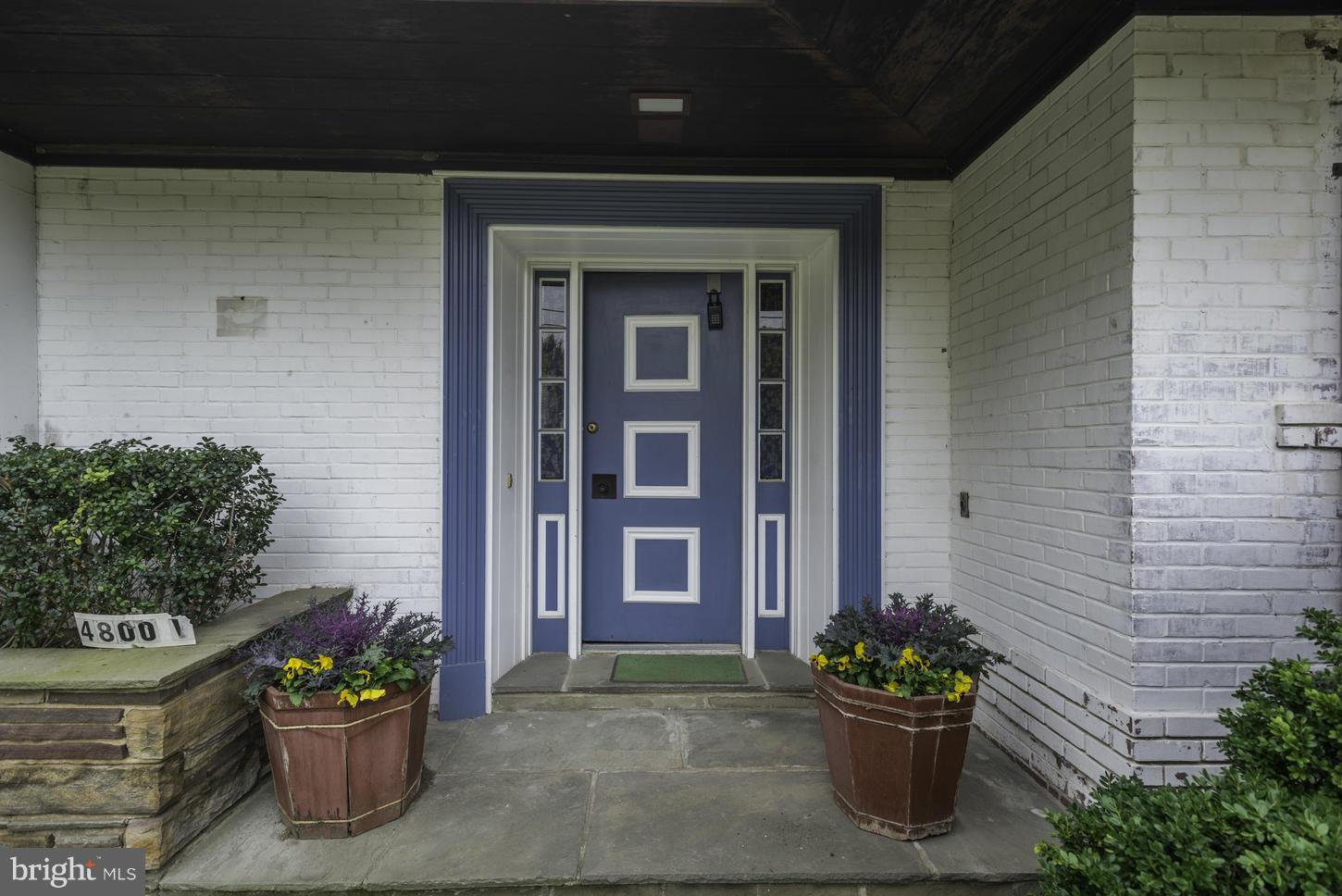 4800 V Street Northwest Washington, DC 20007 - Photo 2 of 4 a front view of a house with a potted plant