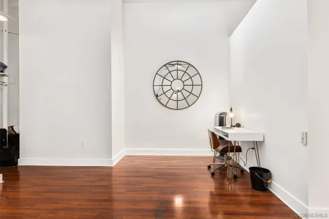 a view of a room with a table and a chair