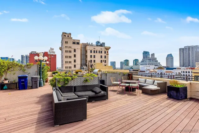 a view of roof deck with seating space and a potted plants