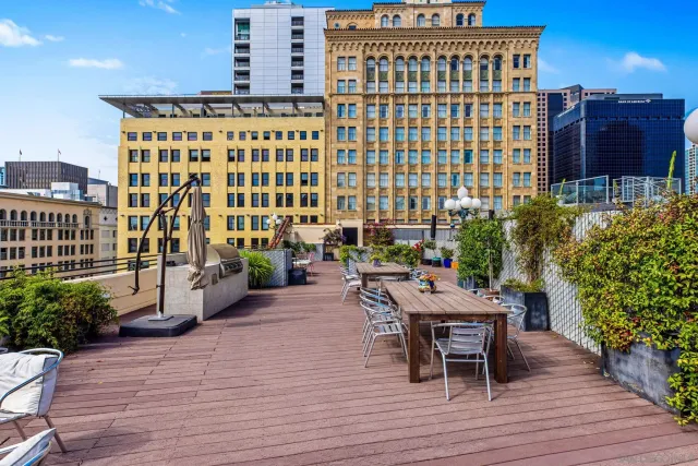 a balcony with table and chairs