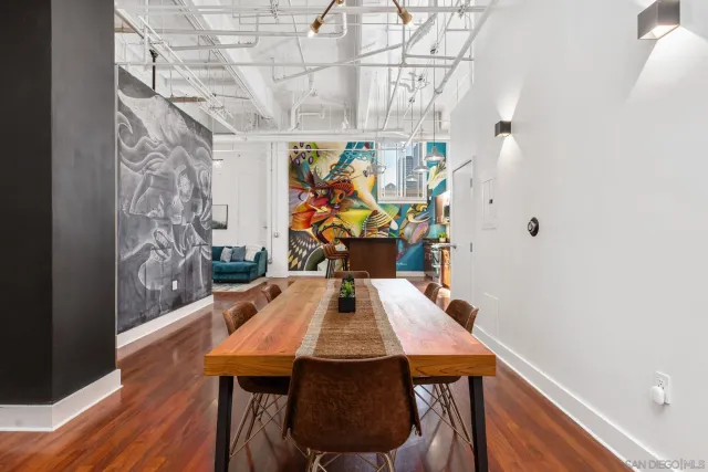 a view of a dining room with furniture and wooden floor