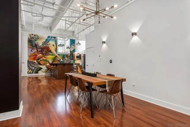a view of a dining room with furniture and wooden floor