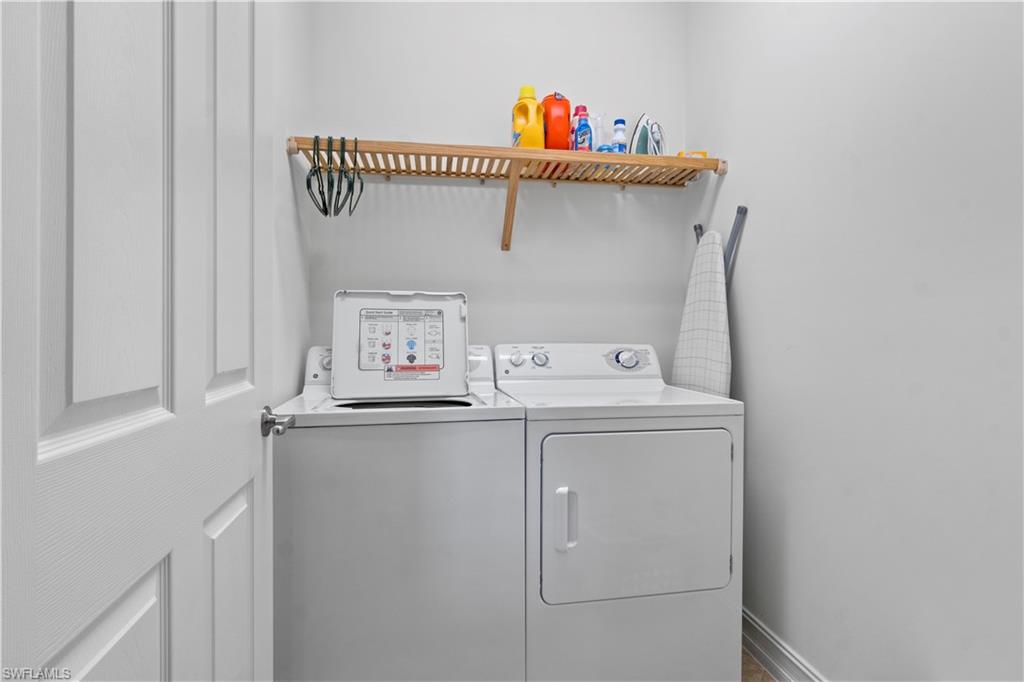 9111 Capistrano Street South, Unit 8303 Naples, FL 34113 - Photo 15 of 29 a utility room with dryer and washer