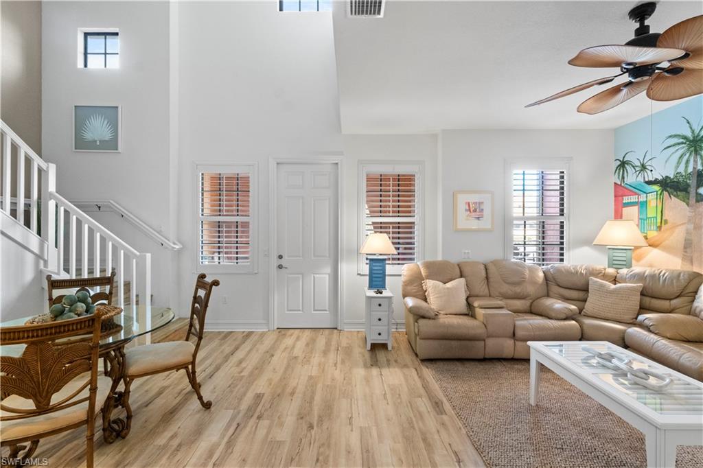 9111 Capistrano Street South, Unit 8303 Naples, FL 34113 - Photo 3 of 29 a living room with furniture fireplace and a window