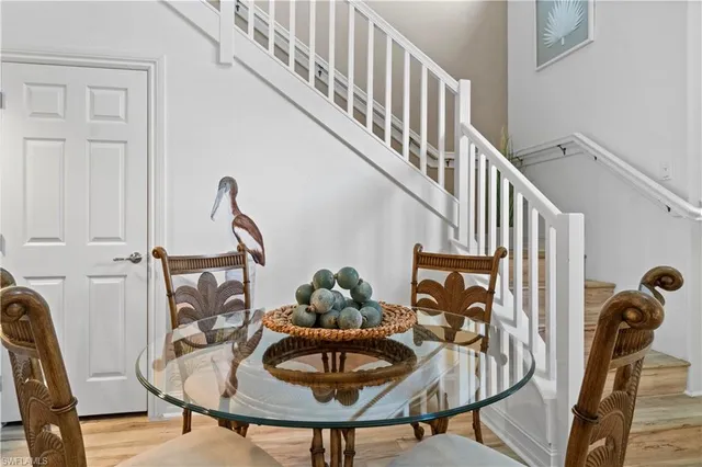a dining room with furniture and entryway