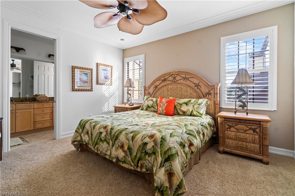 9111 Capistrano Street South, Unit 8303 Naples, FL 34113 - Photo 9 of 29 a bedroom with a bed dresser and a window