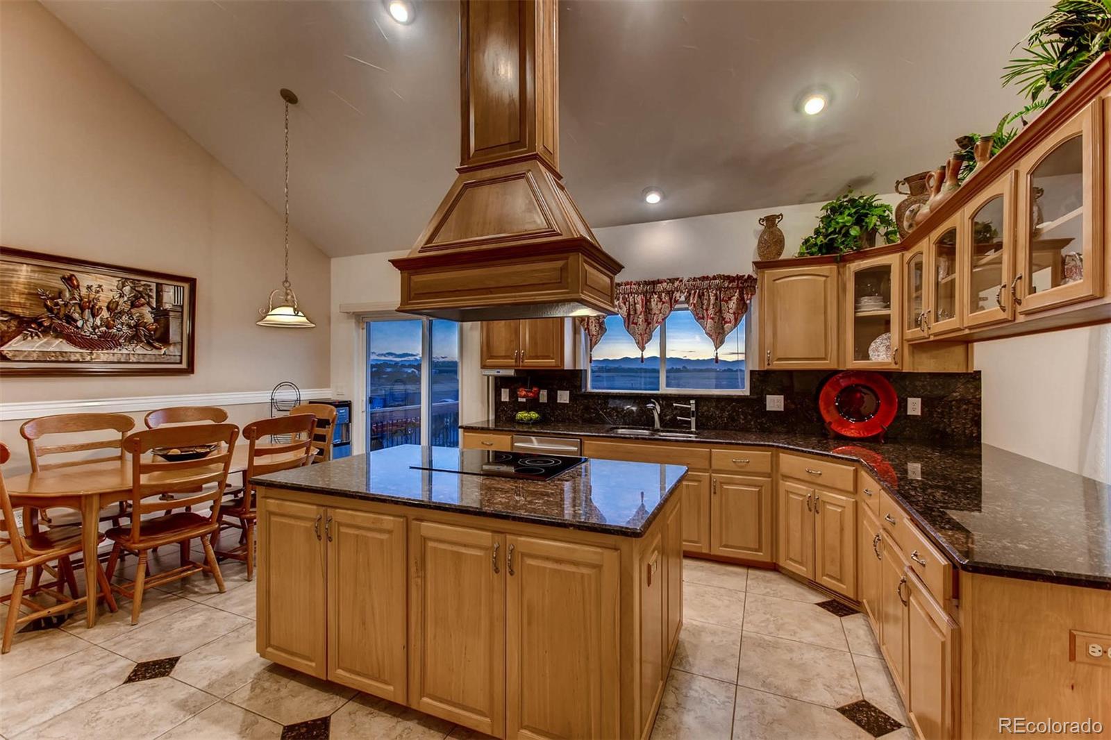 691 Picadilly Road Aurora, CO 80018 - Photo 5 of 27 a kitchen with stainless steel appliances granite countertop a sink and cabinets