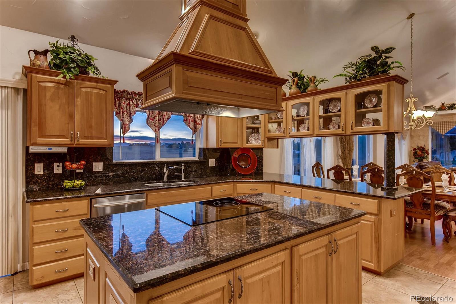 691 Picadilly Road Aurora, CO 80018 - Photo 6 of 27 a kitchen filled with stainless steel appliances granite countertop a sink and cabinets