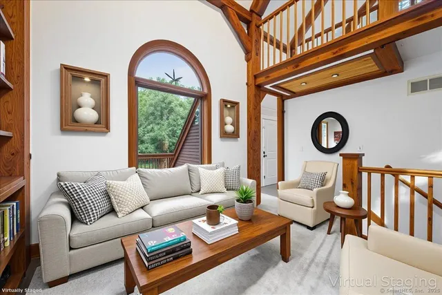 a view of a room with wooden floor and windows