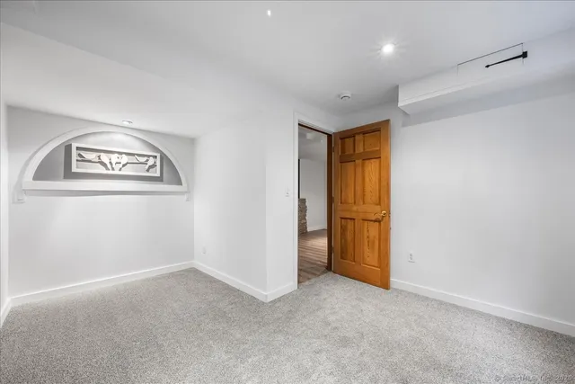 a bedroom with a bed and ceiling fan