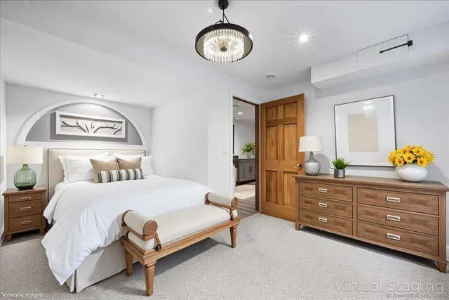 a spacious bedroom with a large bed and a couch