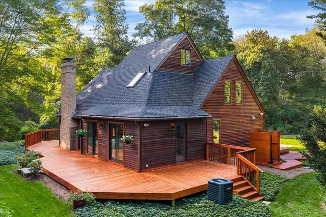 a view of a house with a yard and garden