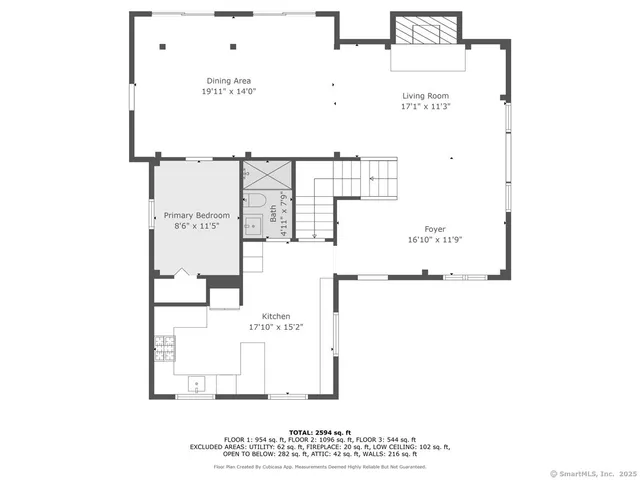 a view of an empty room with a fireplace and a window