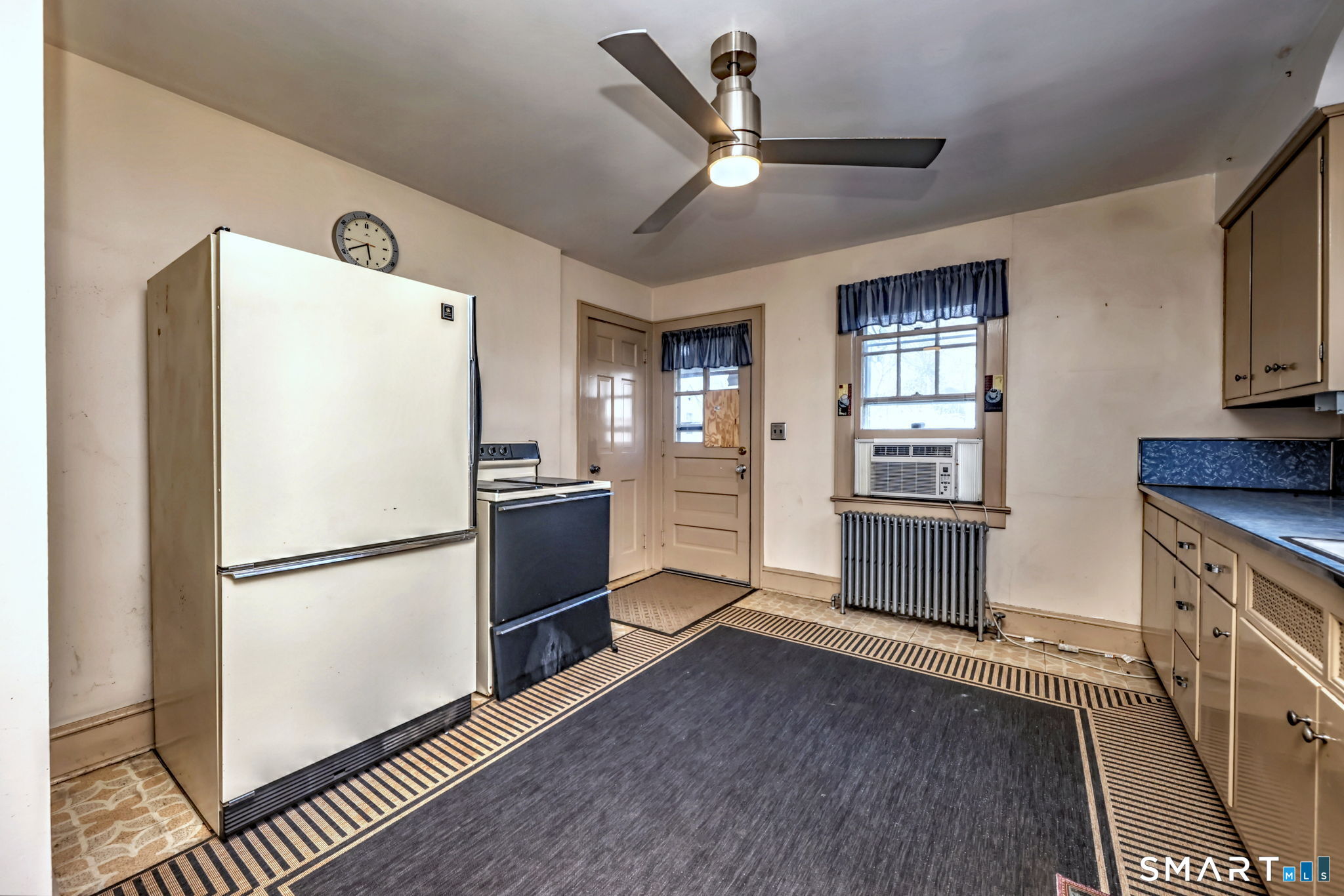 60 Myrtle Street Norwalk, CT 06855 - Photo 11 of 33 a kitchen with granite countertop stainless steel appliances a refrigerator and a sink