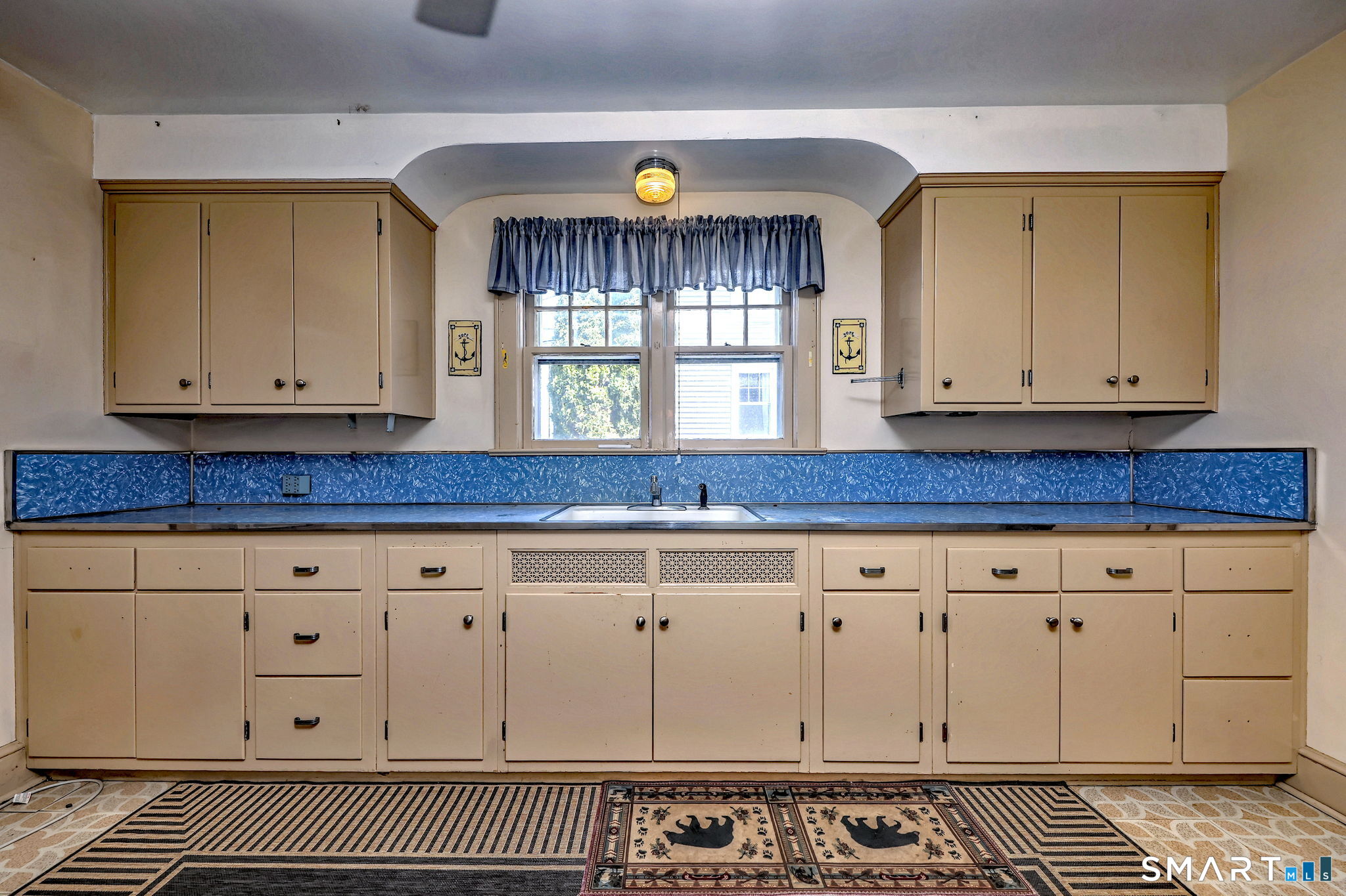 60 Myrtle Street Norwalk, CT 06855 - Photo 13 of 33 a view of a kitchen with granite countertop white cabinets and sink