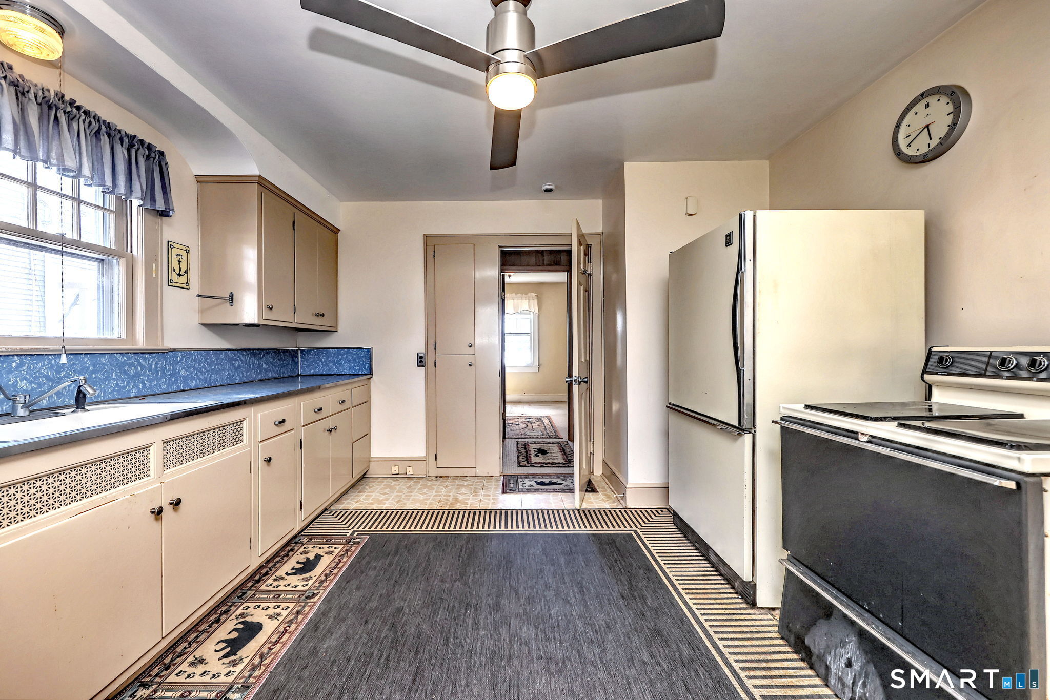 60 Myrtle Street Norwalk, CT 06855 - Photo 14 of 33 a kitchen with stainless steel appliances a refrigerator and a stove