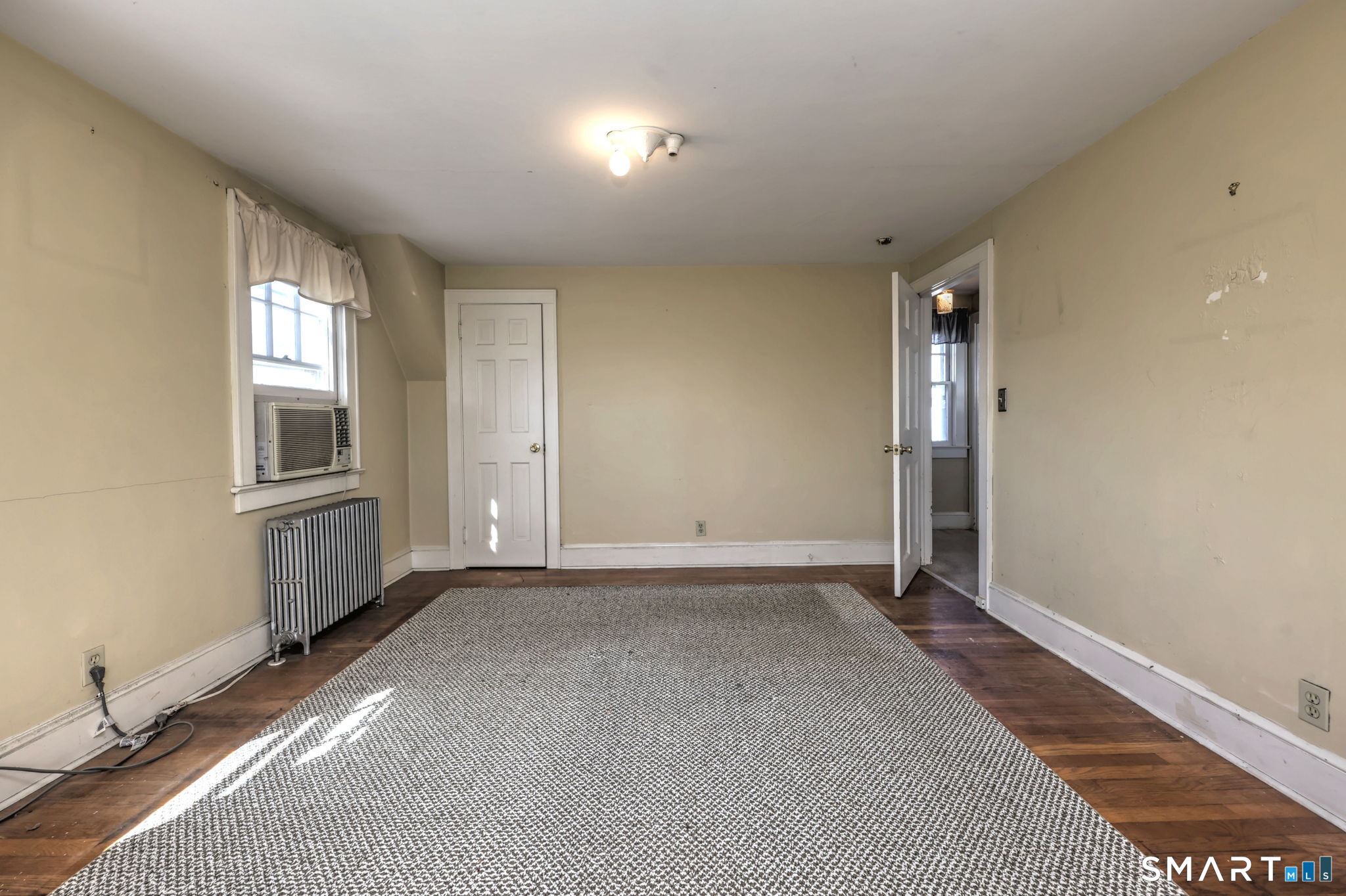 60 Myrtle Street Norwalk, CT 06855 - Photo 20 of 33 a view of an empty room with a window