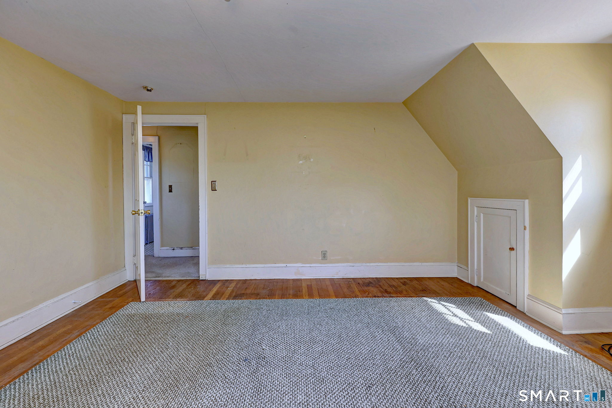 60 Myrtle Street Norwalk, CT 06855 - Photo 21 of 33 a view of an empty room with wooden floor