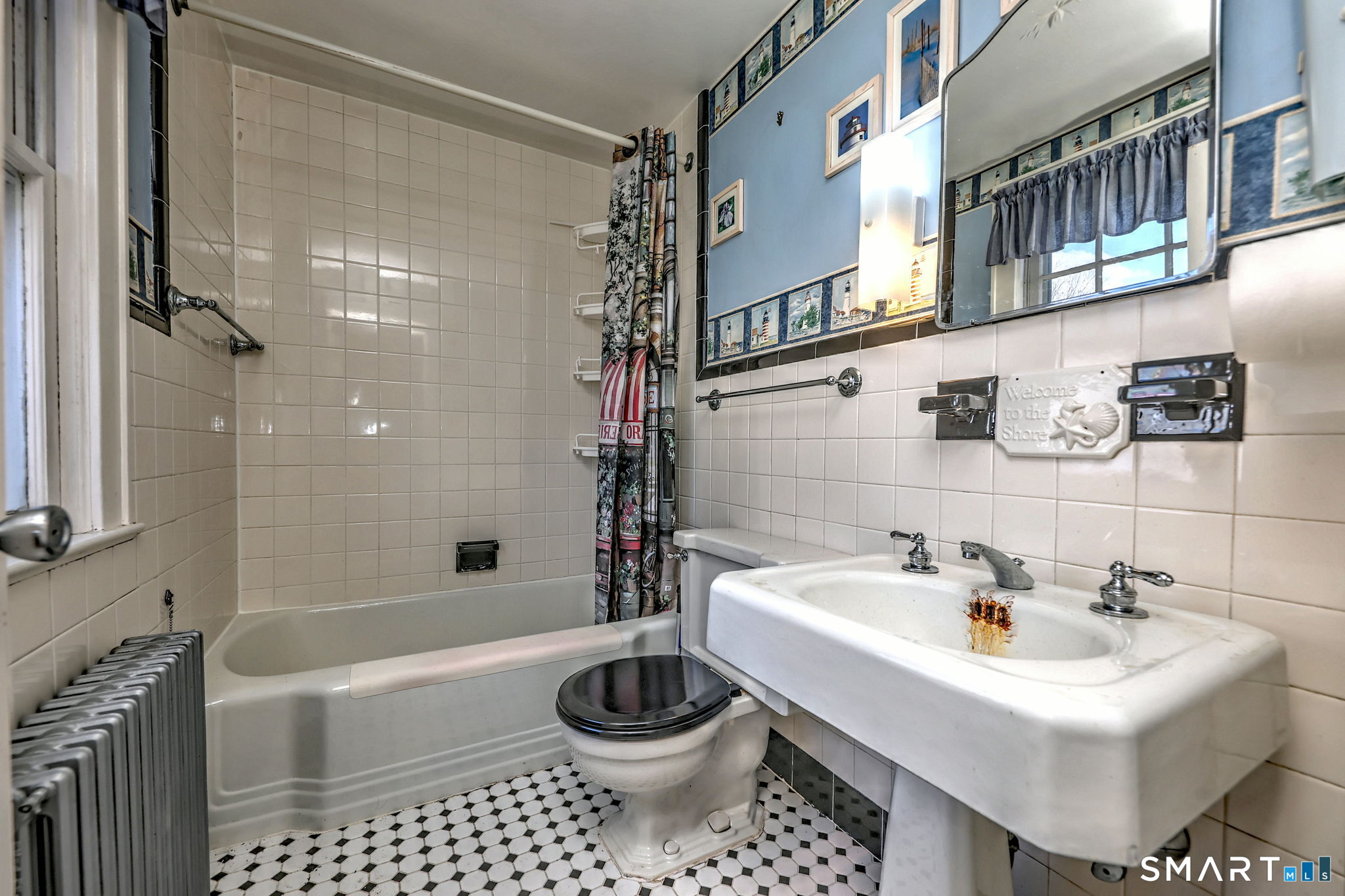 60 Myrtle Street Norwalk, CT 06855 - Photo 27 of 33 a bathroom with a sink a toilet and shower