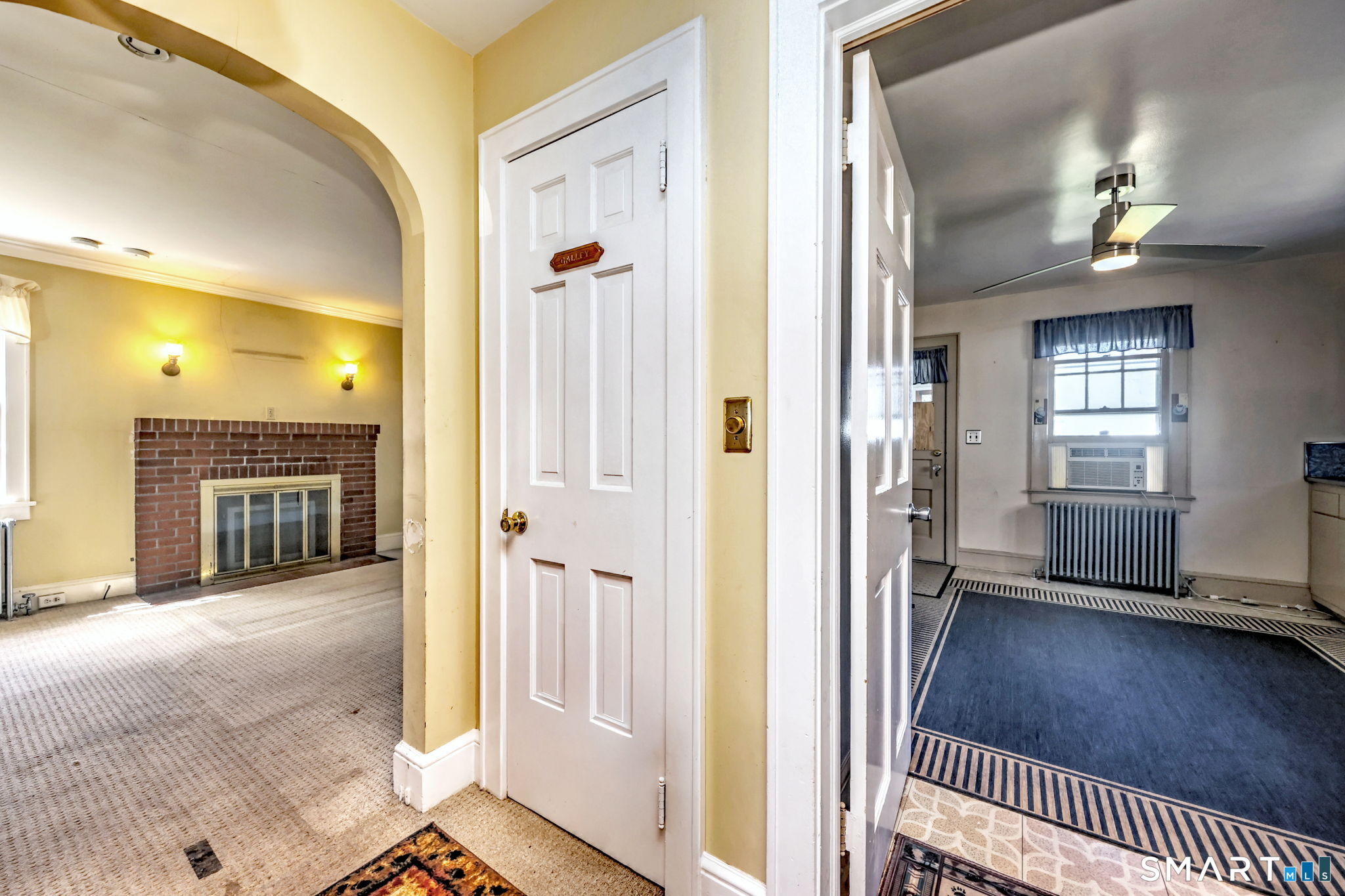 60 Myrtle Street Norwalk, CT 06855 - Photo 3 of 33 a view of a hallway with wooden floor and a living room