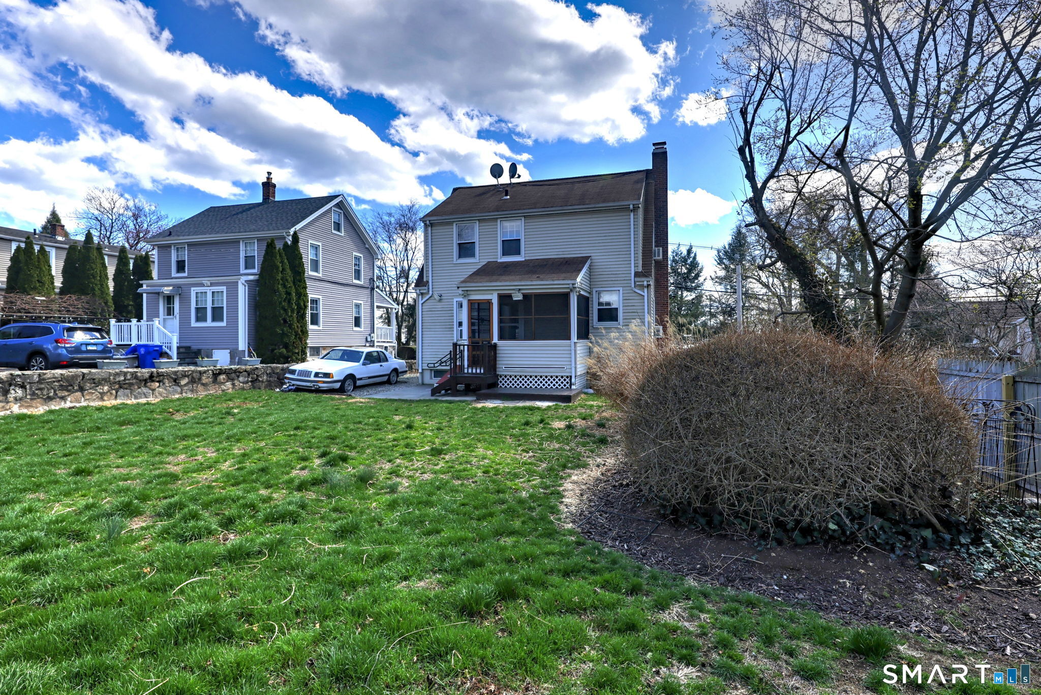 60 Myrtle Street Norwalk, CT 06855 - Photo 31 of 33 a front view of house with yard and green space