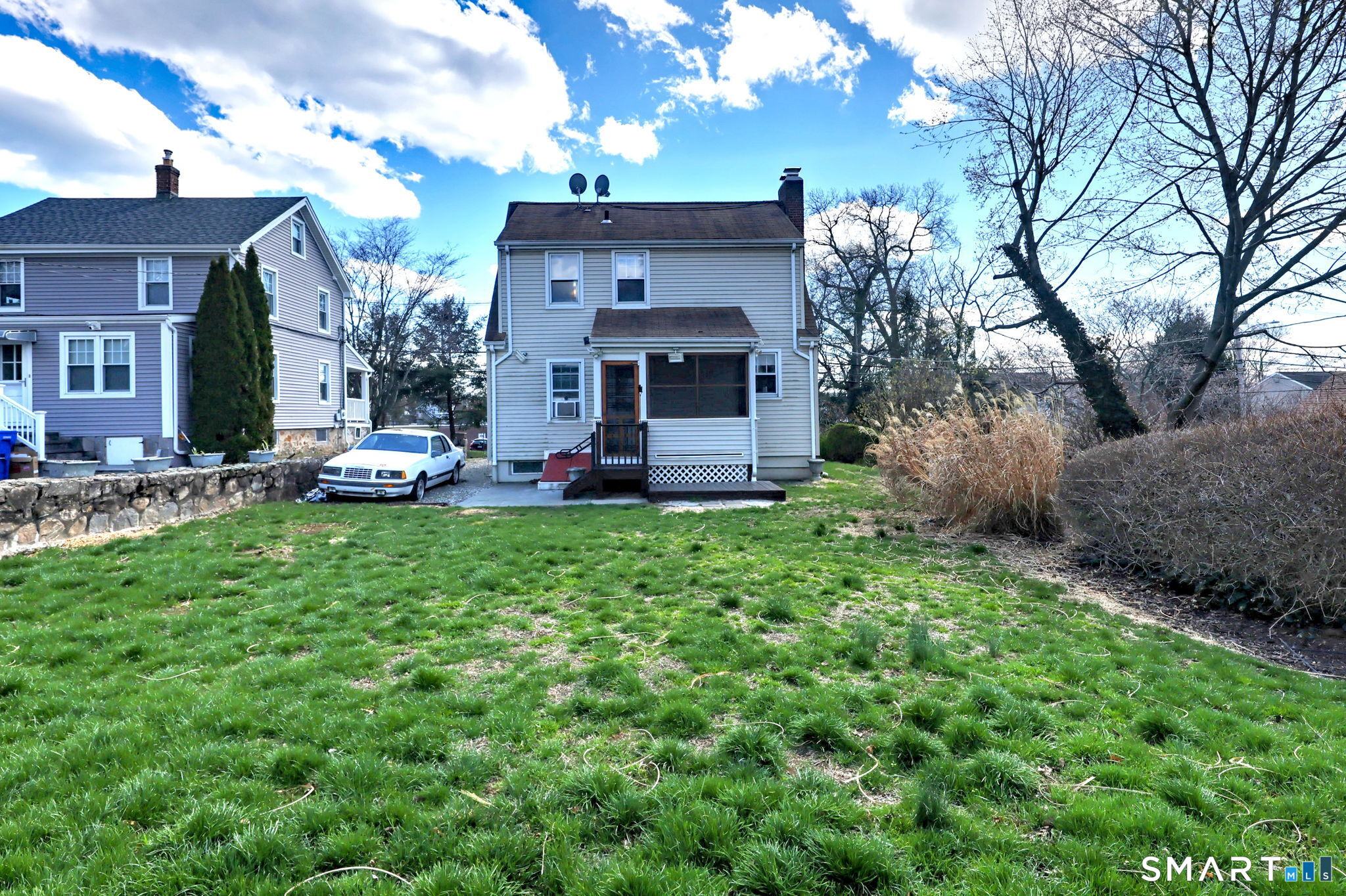 60 Myrtle Street Norwalk, CT 06855 - Photo 32 of 33 a view of a house with a big yard potted plants and large tree