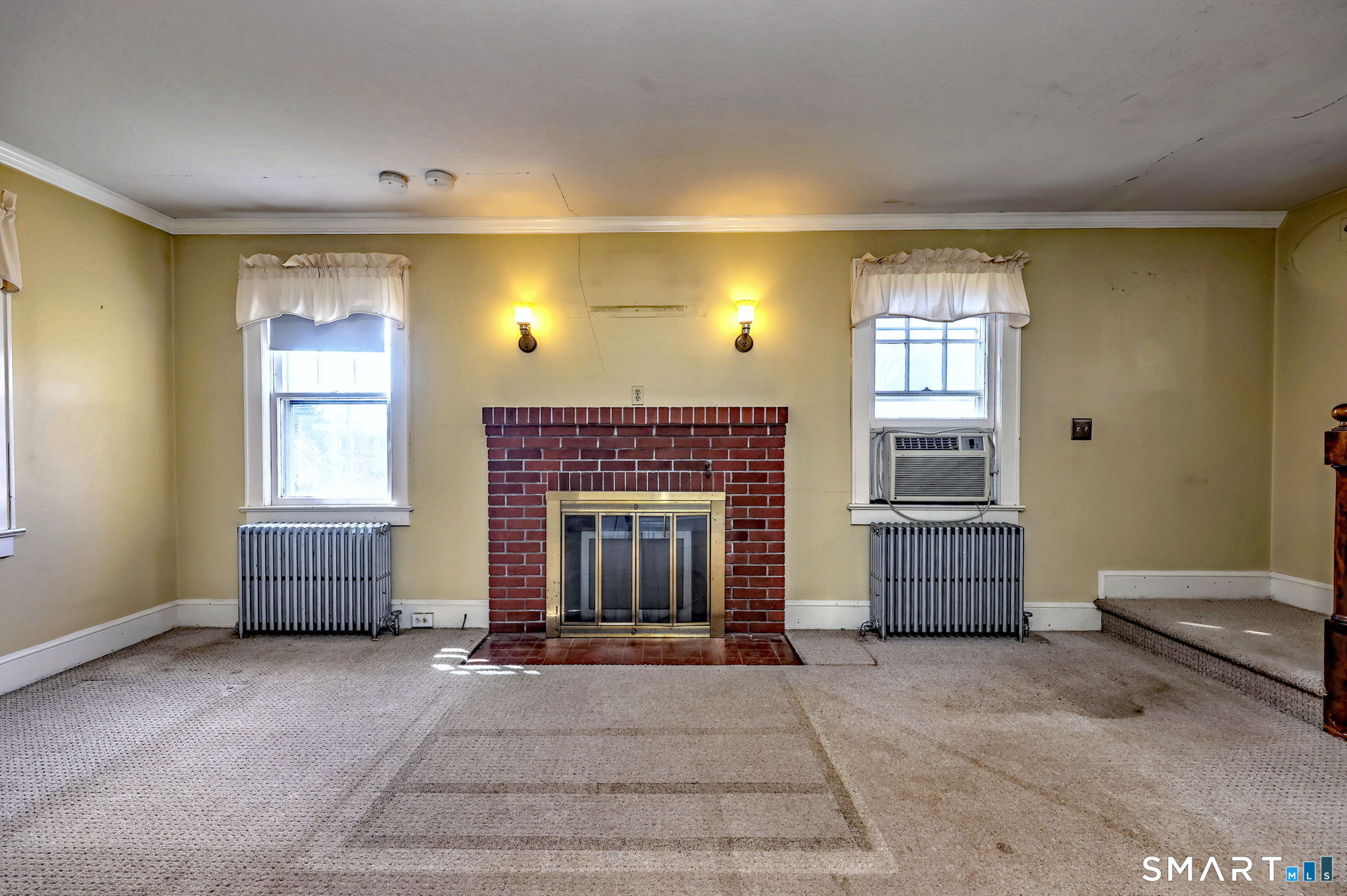 60 Myrtle Street Norwalk, CT 06855 - Photo 5 of 33 a living room with furniture and a fireplace