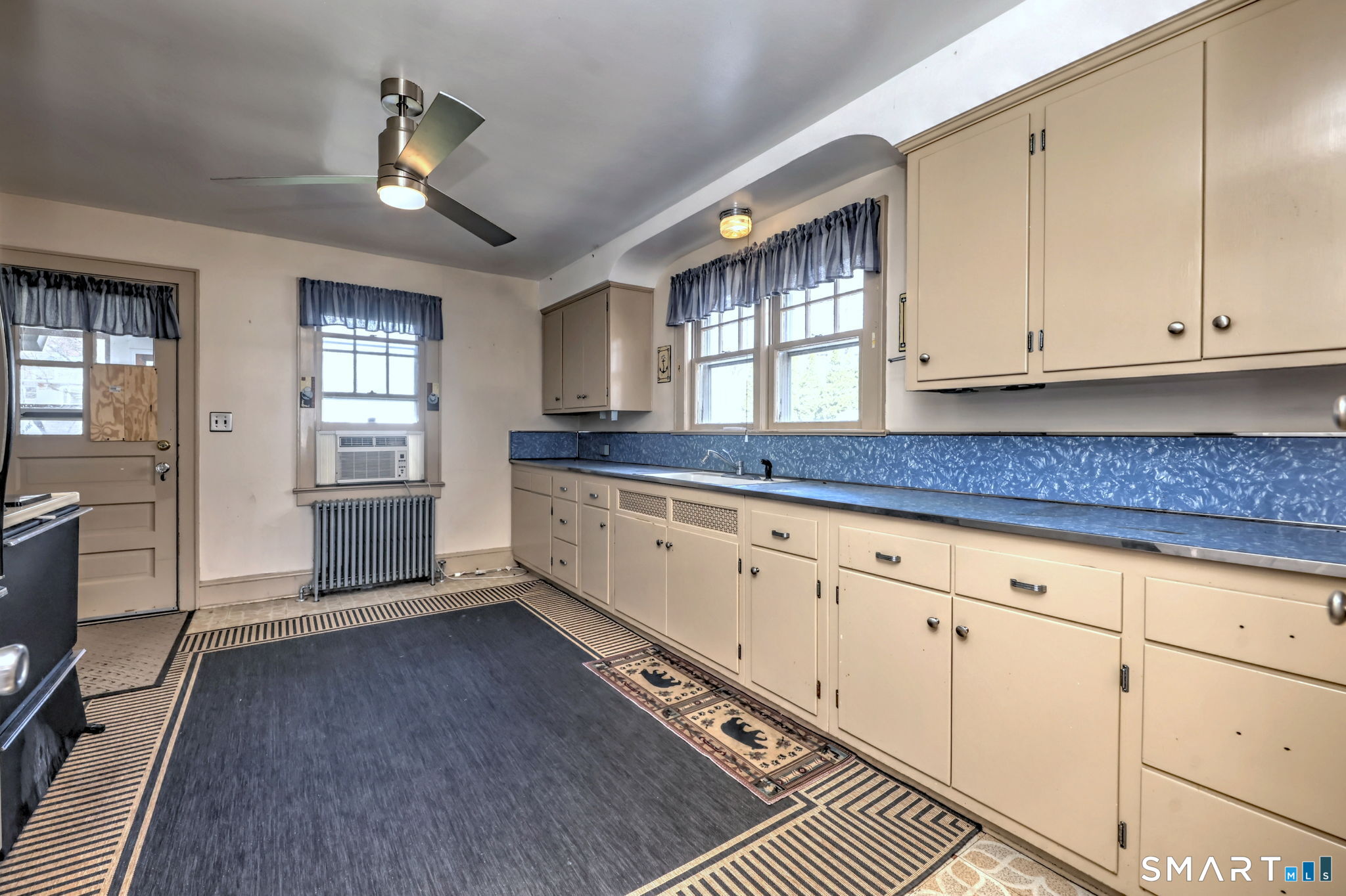 60 Myrtle Street Norwalk, CT 06855 - Photo 10 of 33 a kitchen with granite countertop white cabinets and window