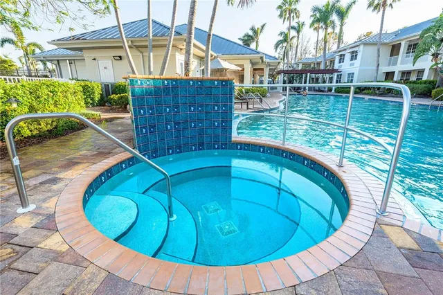 a view of a tennis ground with a large pool