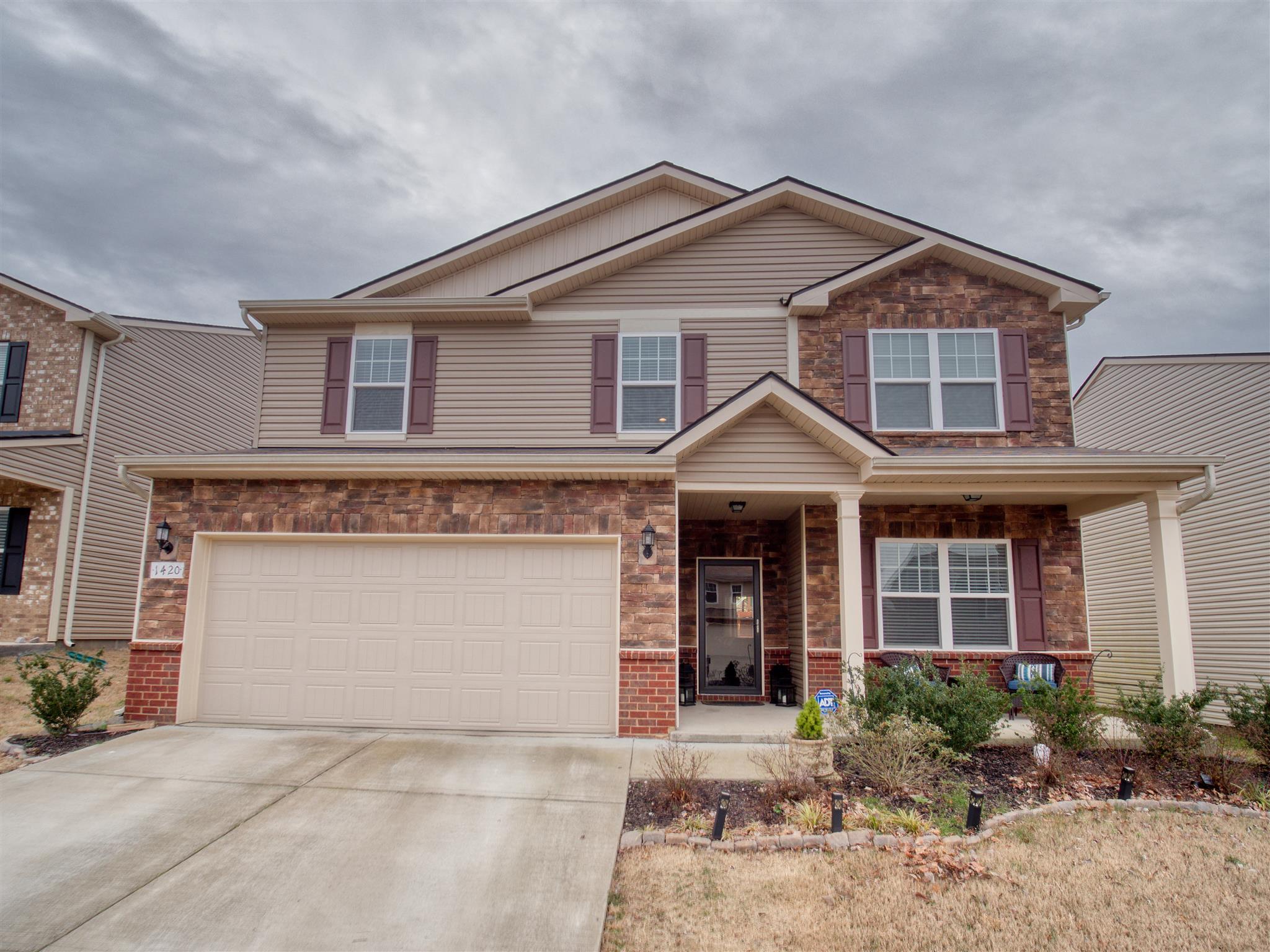 1420 Old Stone Road Lebanon, TN 37087 - Photo 1 of 23 a front view of a house with garden