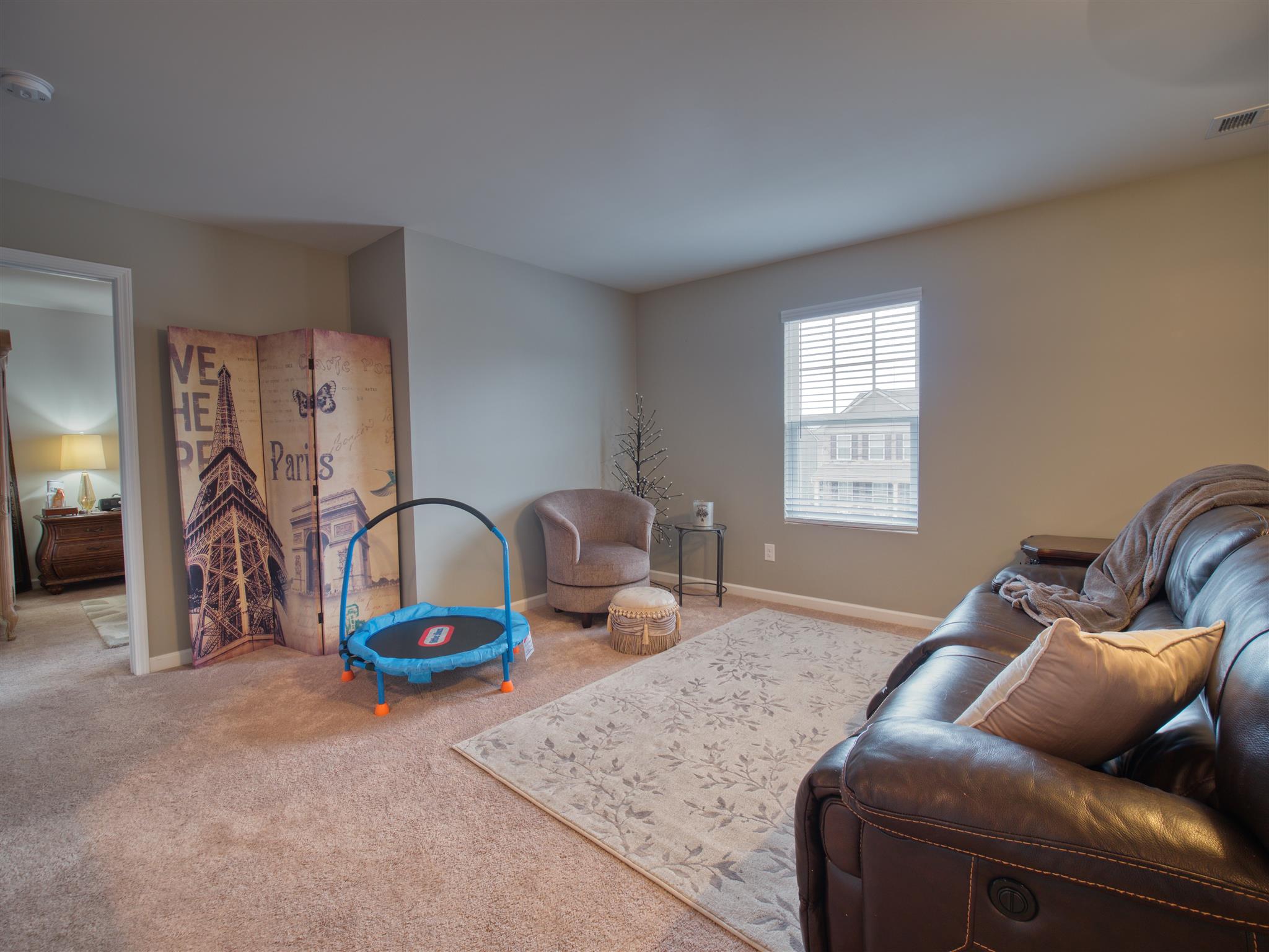 1420 Old Stone Road Lebanon, TN 37087 - Photo 14 of 23 a living room with furniture a air conditioner vent and a window