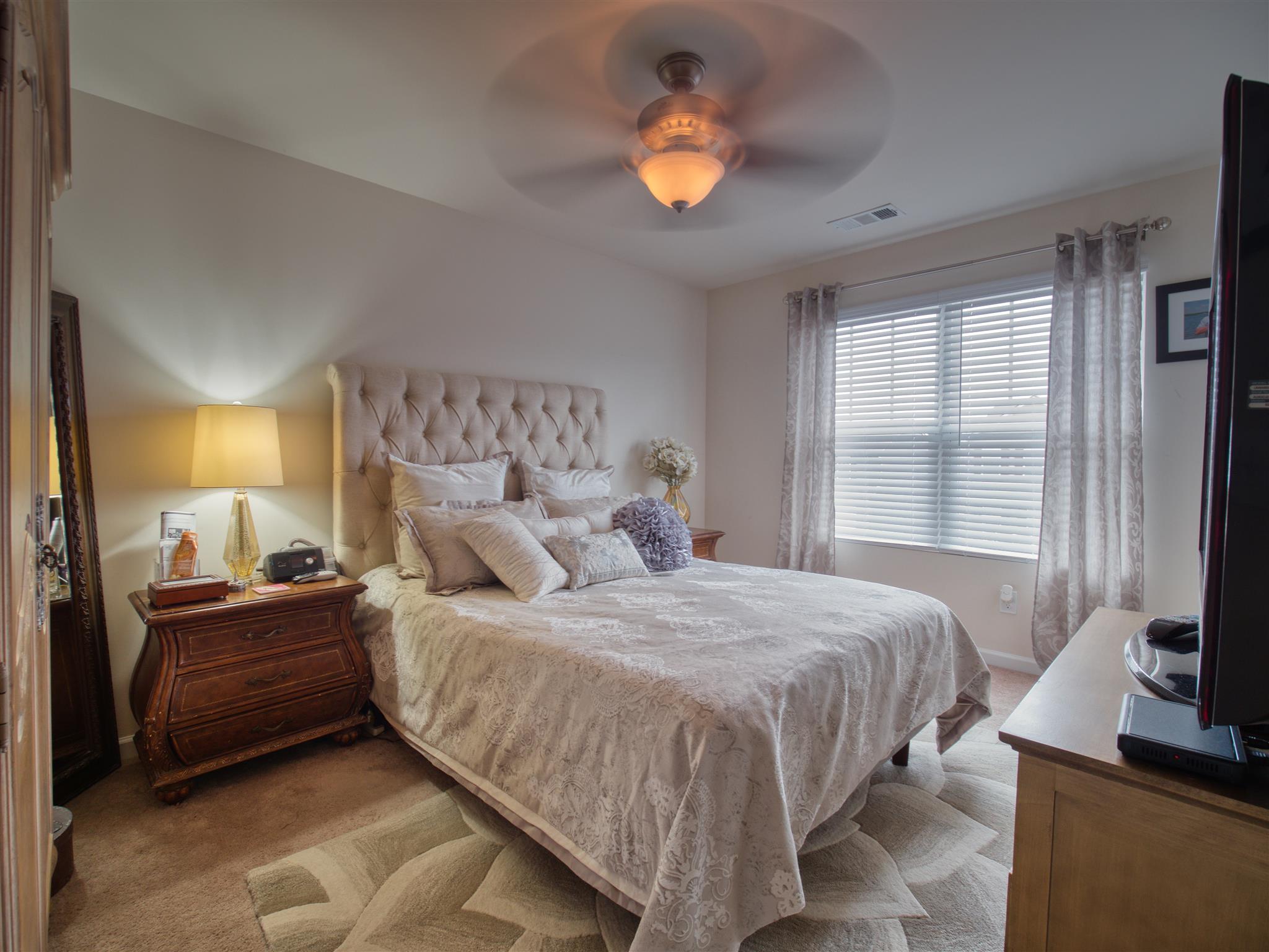 1420 Old Stone Road Lebanon, TN 37087 - Photo 19 of 23 a bedroom with a bed and a flat screen tv