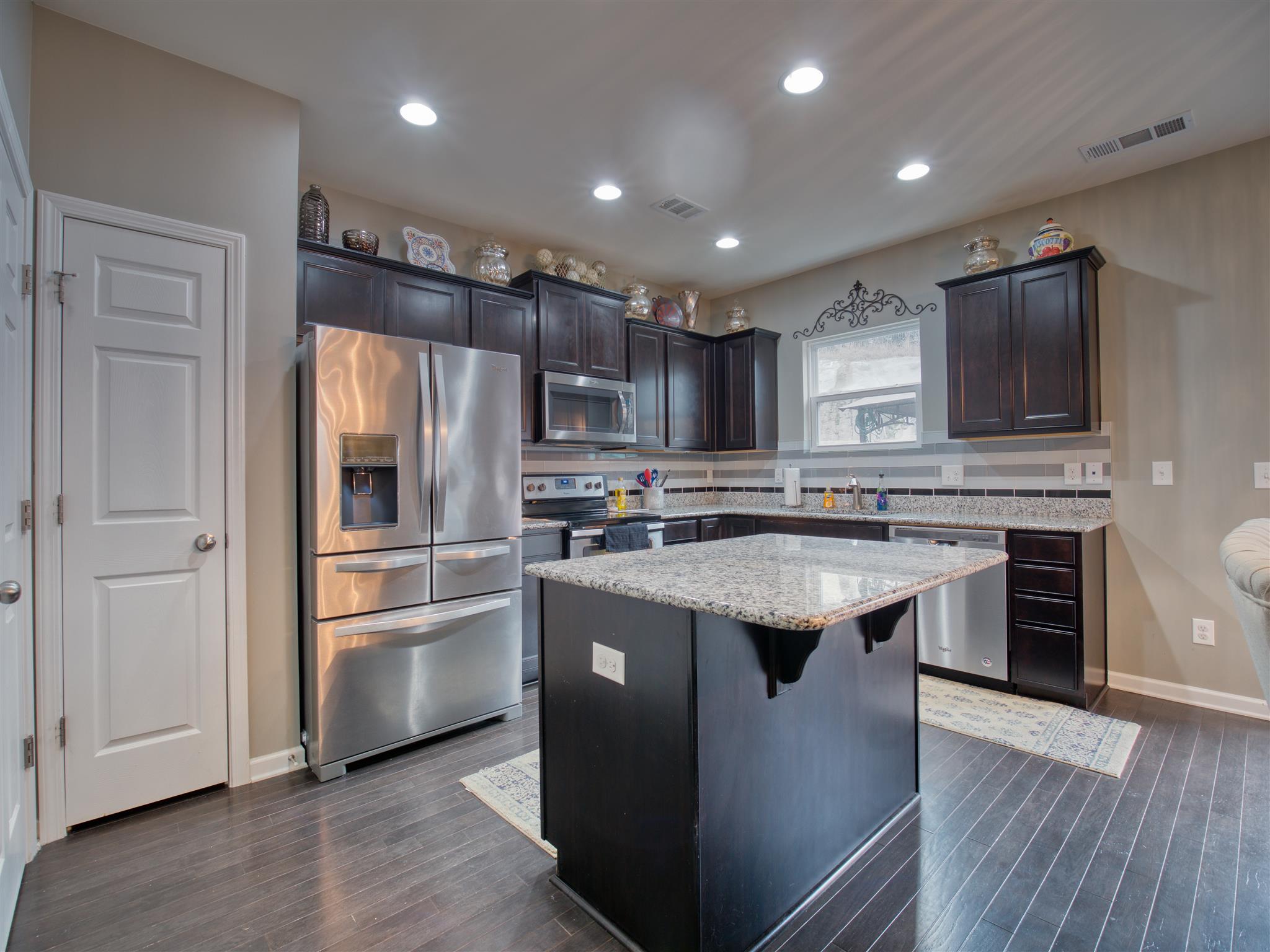 1420 Old Stone Road Lebanon, TN 37087 - Photo 10 of 23 a kitchen with kitchen island granite countertop stainless steel appliances and sink