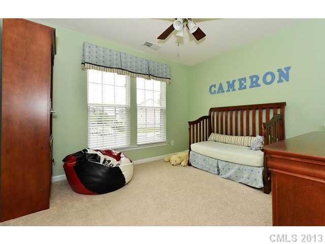 729 Warwick Way Fort Mill, SC 29708 - Photo 11 of 16 a spacious bedroom with a bed and a window