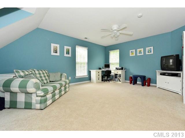 729 Warwick Way Fort Mill, SC 29708 - Photo 13 of 16 a living room with furniture and a flat screen tv