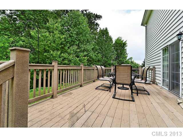 729 Warwick Way Fort Mill, SC 29708 - Photo 14 of 16 a view of a deck with table and chairs and wooden floor