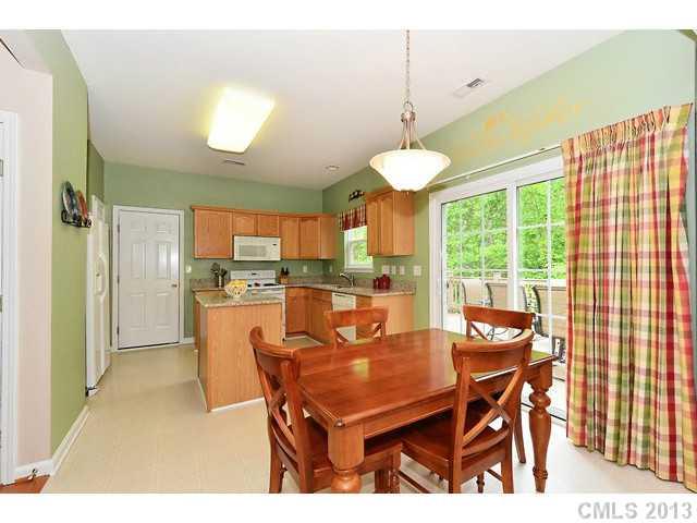 729 Warwick Way Fort Mill, SC 29708 - Photo 6 of 16 a kitchen with a table and chairs