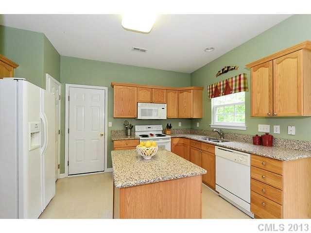 729 Warwick Way Fort Mill, SC 29708 - Photo 7 of 16 a kitchen with a sink stove and refrigerator
