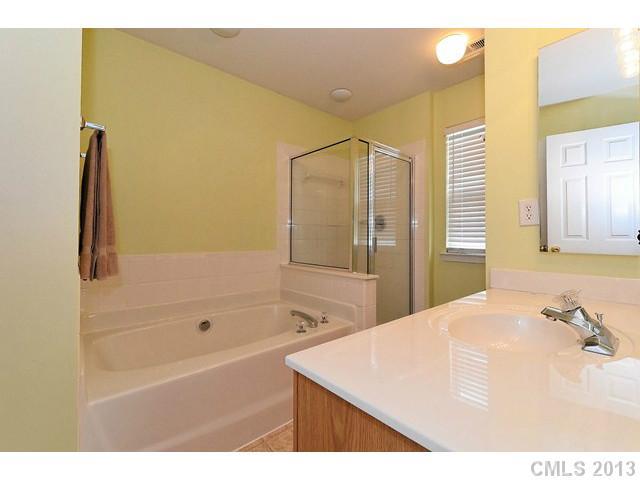 729 Warwick Way Fort Mill, SC 29708 - Photo 9 of 16 a bathroom with a bathtub and a shower