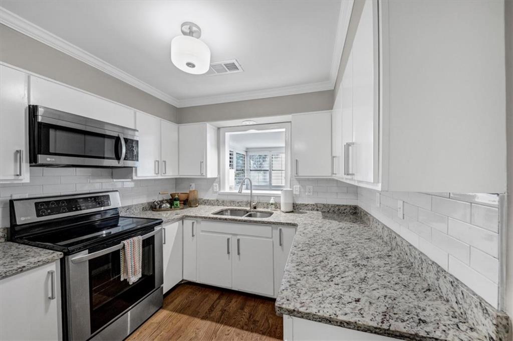 37 La Rue Place Northwest Atlanta, GA 30327 - Photo 12 of 35 a kitchen with a sink stove and microwave
