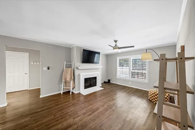 a view of livingroom with furniture fireplace and wooden floor