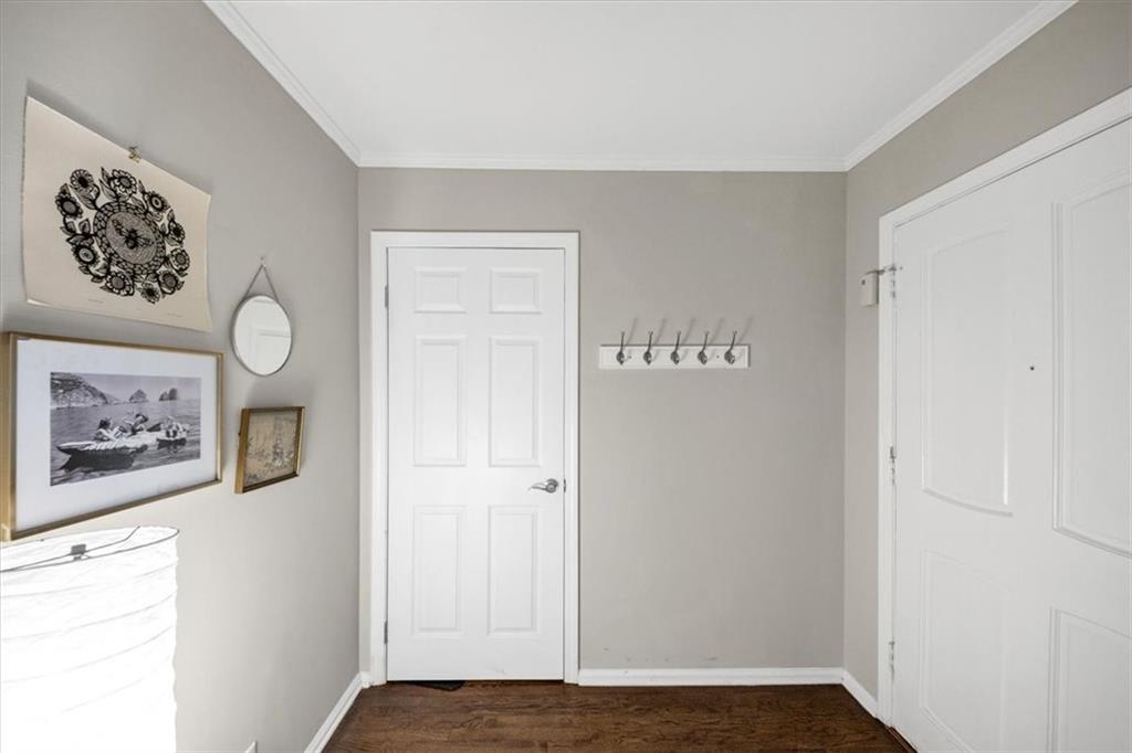 37 La Rue Place Northwest Atlanta, GA 30327 - Photo 6 of 35 a view of a hallway with wooden floor and closet