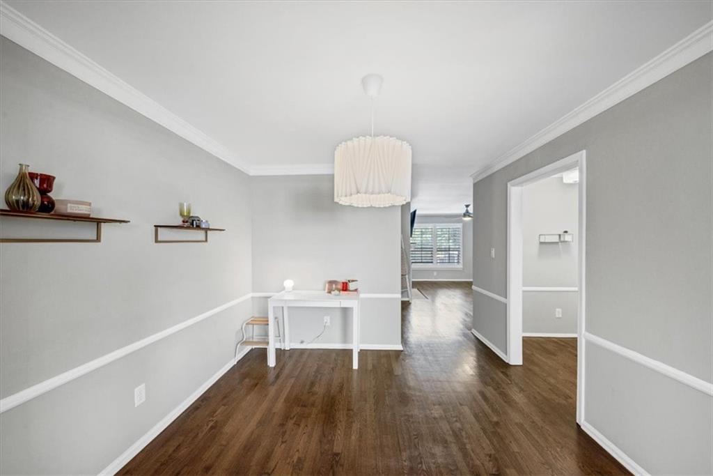 37 La Rue Place Northwest Atlanta, GA 30327 - Photo 8 of 35 wooden floor in an empty room with a window
