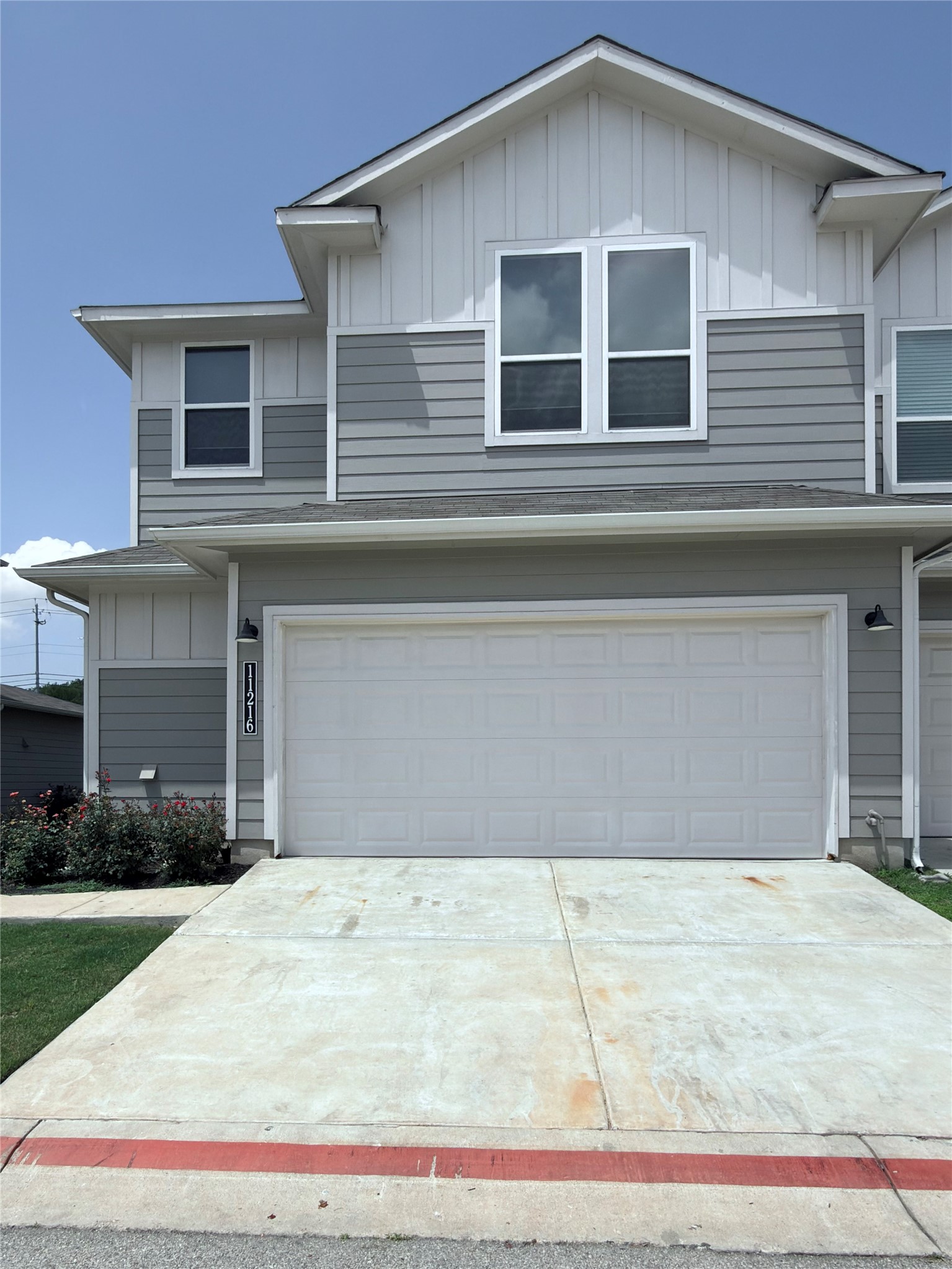11216 Gadsen Lane Austin, TX 78754 - Photo 2 of 36 A contemporary exterior showcasing horizontal siding and a prominent two-car garage.