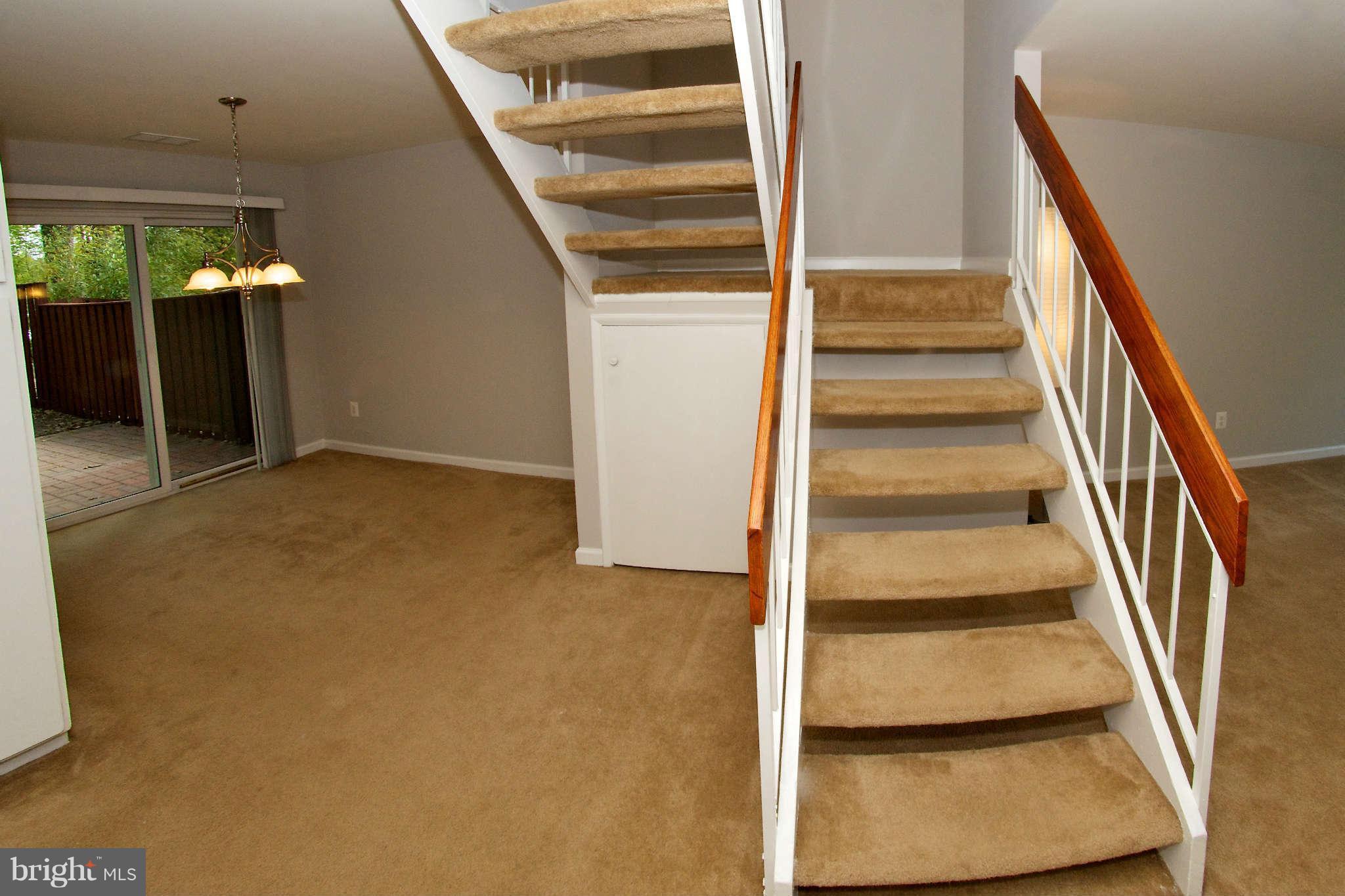 2211 Southgate Square Reston, VA 20191 - Photo 13 of 26 a view of staircase with white walls and a window