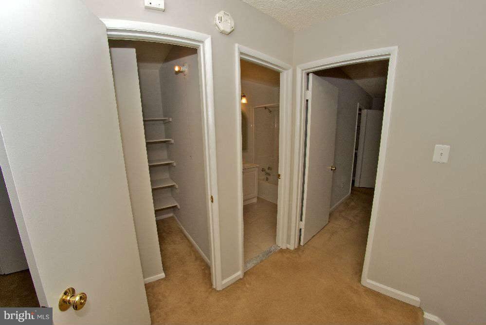 2211 Southgate Square Reston, VA 20191 - Photo 16 of 26 a view of a hallway with wooden floor and closet