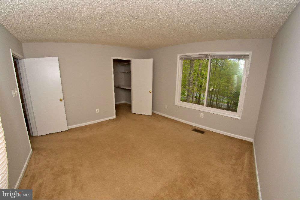 2211 Southgate Square Reston, VA 20191 - Photo 17 of 26 an empty room with windows and closet