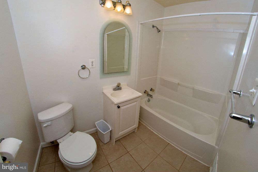 2211 Southgate Square Reston, VA 20191 - Photo 22 of 26 a white toilet sitting next to a bath tub